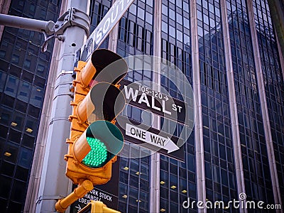 View on Wall street yellow traffic light with black and white Wa Stock Photo