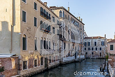 View of the water channels, bridges and old palaces in Venice at sunset Stock Photo