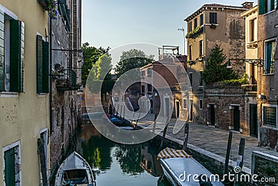 View of the water channels, bridges and old palaces in Venice at sunset Stock Photo