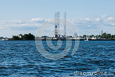 View from the water on the coastline of Kronstadt,cargo ships,Floating drilling rig,drilling cranes.Russia,Kronstadt,31 Editorial Stock Photo