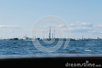 View from the water on the coastline of Kronstadt,cargo ships,Floating drilling rig,drilling cranes.Russia,Kronstadt,31 Editorial Stock Photo