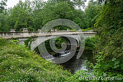 View of the White Bridge, spanning Crum Elbow Creek. It has an elegant arch, ornamented Editorial Stock Photo