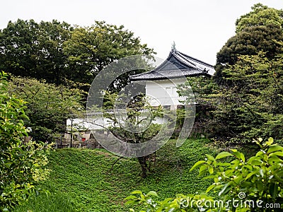 View of the white tower of former Edo castle across Ushigafuchi moat in summer Stock Photo