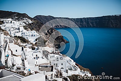 View of whitewashed houses and blue dome in caldera Aegean Sea oia Santorini Greece Stock Photo