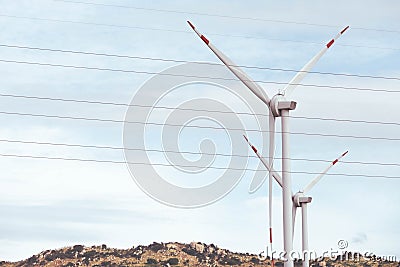 View of wind farm with high wind turbines for generation electricity Stock Photo