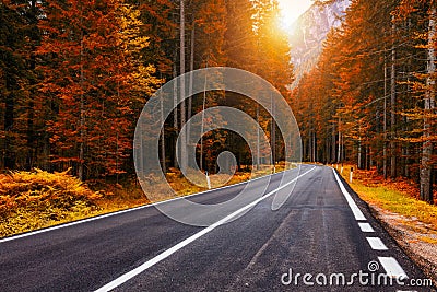 View of winding road. Asphalt roads in the Italian Alps in South Tyrol, during autumn season. Autumn scene with curved road and Stock Photo