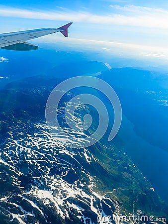 View from window of airplane flying over Norway Scandinavia. Stock Photo