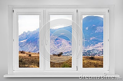 View from the window. Mountain forest landscape under evening sk Stock Photo