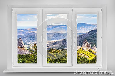 View from the window. Mountain forest landscape under evening sk Stock Photo