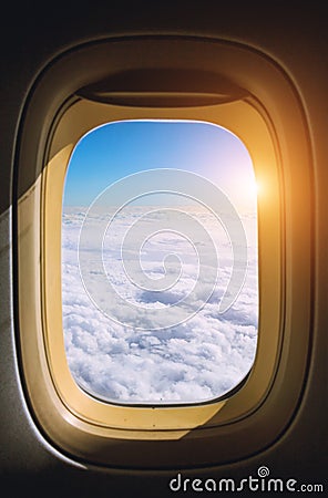View from the window plane on amazing sky with scenic clouds at the sunset. Stock Photo