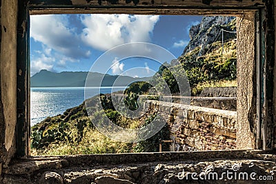 View from a window of the ruins of the lighthouse of Capo Zafferano in Sicily (Italy) Stock Photo