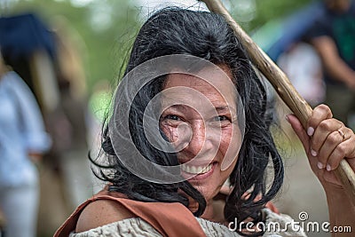 View of a witch face performing in medieval market, actress dressed in witch& x27;s robes Editorial Stock Photo