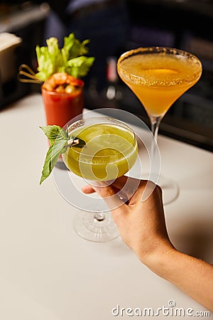 View of woman holding margarita glass Stock Photo