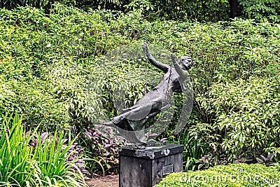 The women on a swing sculpture at Singapore Botanical Gardens. Editorial Stock Photo