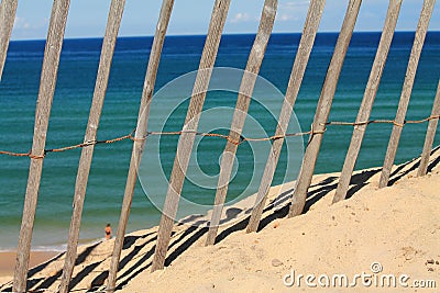 View through wooden fence in hot summer day on atlantic ocean Stock Photo