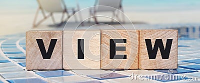 View word on wooden cubes on ocean beach background. Business career concept Stock Photo