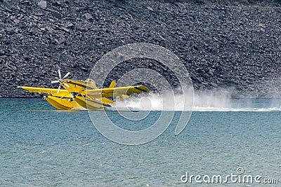 View of fire fighting float plane loading water. Editorial Stock Photo