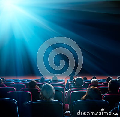 Viewers look at shining star in the cinema Stock Photo
