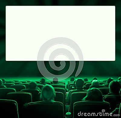 Viewers at movie theater, green toning Stock Photo