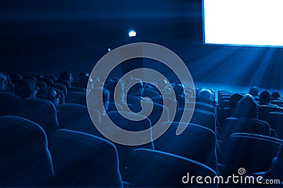 Viewers watch a 3D movie, blue toning Editorial Stock Photo