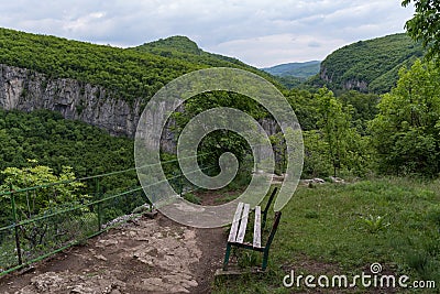 Viewpoint `The bench of Love` on edge of canyon Dryanovo river near.Monastery St. Archangel Michael, Gabrovo region, Bulgaria Stock Photo