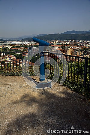 Viewpoint with a coin operated eyeglass on a balcony in a park on a sunny day Stock Photo