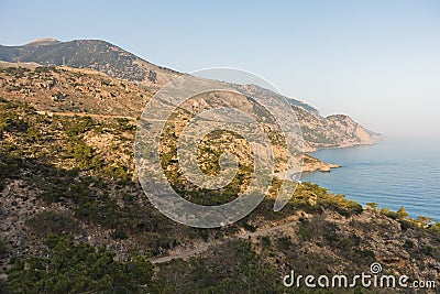 Viewpoint on a hiking trail near Lissos gorge to a coastline above Sougia bay at sunset, south-west coast of Crete island Stock Photo
