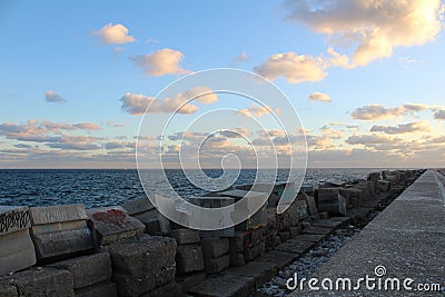 Views of the Fuengirola dike in the harbor at sunset Stock Photo