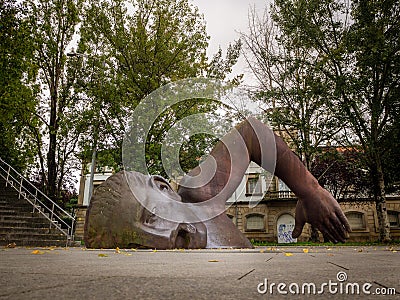 VIGO, SPAIN - Oct 29, 2019: The Swimmer, a bronze iconic statue by Francisco Leiro Editorial Stock Photo