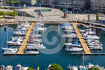 Vigo, Spain - September 8, 2018: Cityscape of Vigo with moored yachts, Port of Vigo, Galicia, Spain Editorial Stock Photo