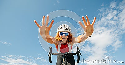 Vigorous young ginger woman riding on a professional bike hands free Stock Photo