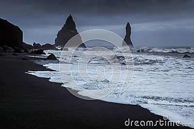 Vik and Basalt Columns, Black Sand Beach in Iceland Stock Photo