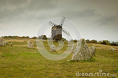 Viking burial site and a windmill in Gettlinge, Sweden Stock Photo