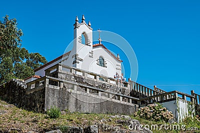 Vila ChÃ£, Esposende - PORTUGAL August 7th 2021 - Perspective of the wall and staircase of SÃ£o LourenÃ§o Chapel with a family Editorial Stock Photo