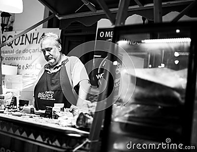 Vilareal de Santo Antonio , Portugal - OCT 12 2.019 - cheese seller in street market Editorial Stock Photo