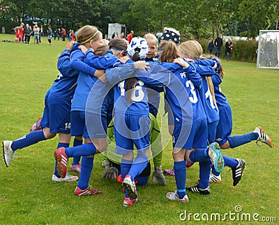 Vildbjerg, Denmark - August 2, 2015 - Junior female soccer player team spirit Editorial Stock Photo
