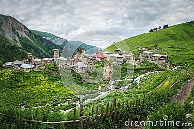 Village of Adishi in Svaneti, Georgia. View of mountain village in Caucasus mountains with ancient Svan towers and mount streams Stock Photo