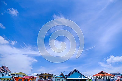 Village against sky clouds, blue fluffy clean, bright weather light summer Stock Photo