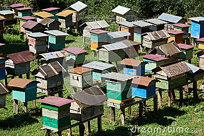 Village apiary in the highlands with homemade beehives Stock Photo
