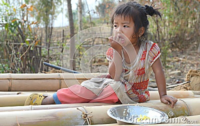 Hungry Village child eating Meal Editorial Stock Photo