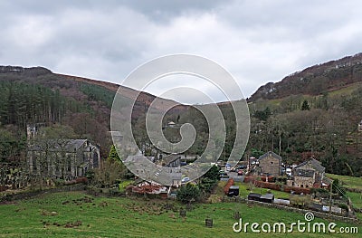 The village of cragg vale in calderdale west yorkshire showing the church and houses between high pennine hills Stock Photo