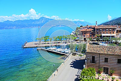 Village of Torri Del Benaco on the garde& x27;s lake beautiful blue water and sky Editorial Stock Photo