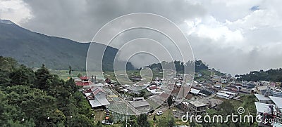village in the highlands covered in cloud Stock Photo
