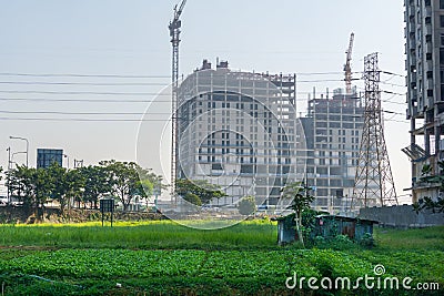 Village hut and city skyscraper Stock Photo