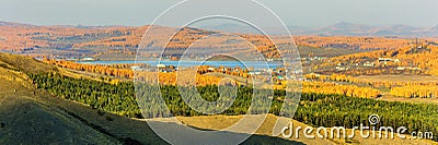 The village of Mindyak on the shore of the lake among the Ural Ridges of Miguele in late autumn Stock Photo