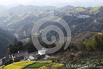 Village in the mountains, the yellow and winding mountain path Stock Photo