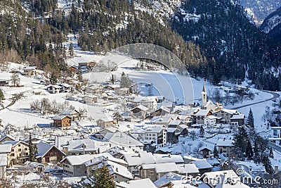 Village in a narrow valley in winter afternoon Stock Photo