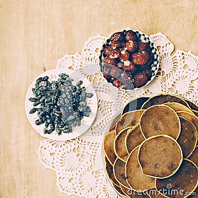 Village pancakes on wooden background on patterned napkins Stock Photo
