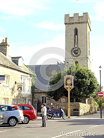 Village sign and church, Yarmouth, Isle of Wight. Editorial Stock Photo