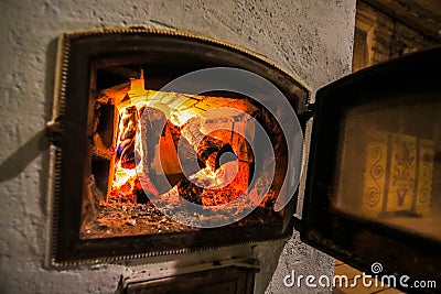 Village stove firewood and fire Stock Photo
